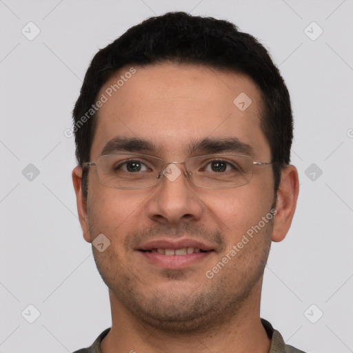 Joyful white young-adult male with short  black hair and brown eyes