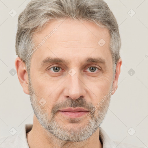 Neutral white middle-aged male with short  gray hair and brown eyes