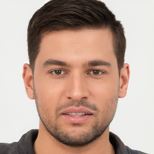 Joyful white young-adult male with short  brown hair and brown eyes