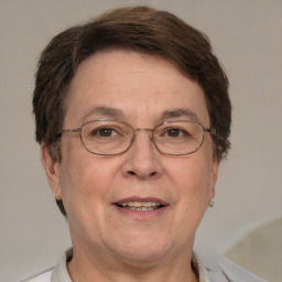 Joyful white middle-aged male with short  brown hair and brown eyes