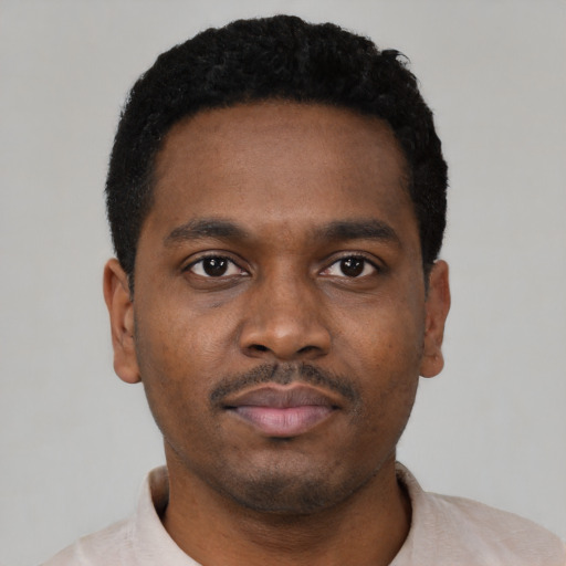 Neutral black young-adult male with short  black hair and brown eyes