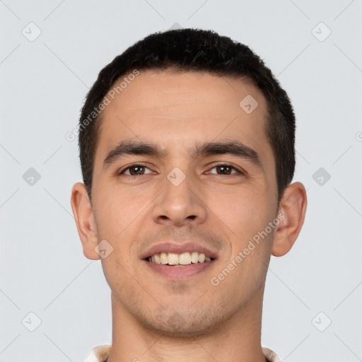 Joyful white young-adult male with short  black hair and brown eyes