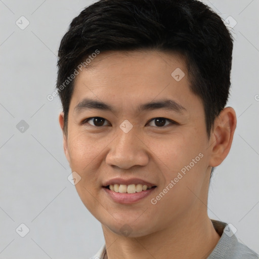 Joyful asian young-adult male with short  brown hair and brown eyes