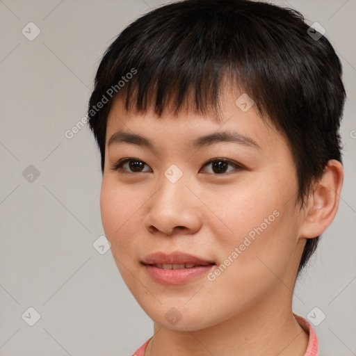 Joyful asian young-adult female with short  brown hair and brown eyes