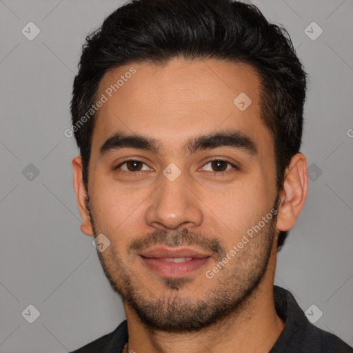 Joyful white young-adult male with short  black hair and brown eyes