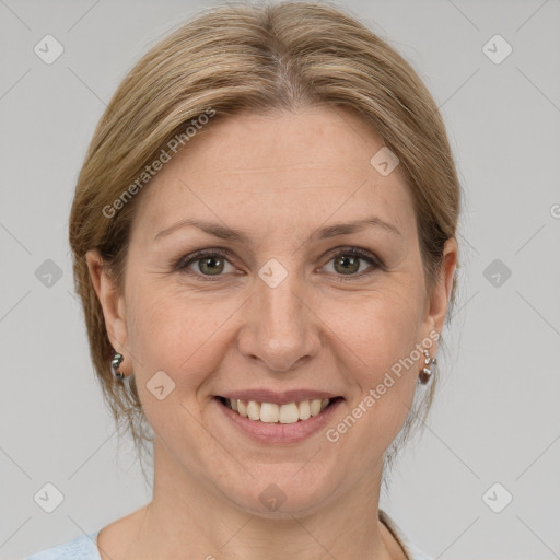 Joyful white adult female with medium  brown hair and grey eyes