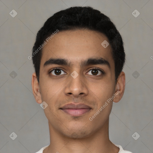 Joyful latino young-adult male with short  black hair and brown eyes