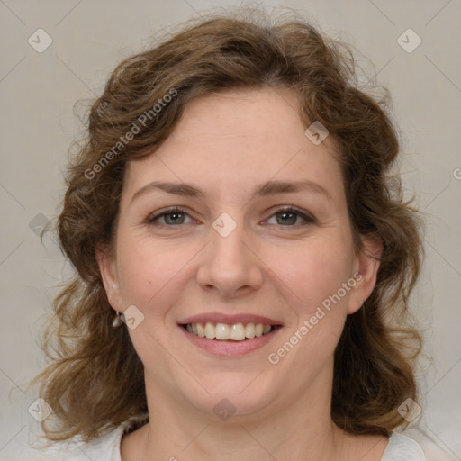 Joyful white young-adult female with medium  brown hair and green eyes