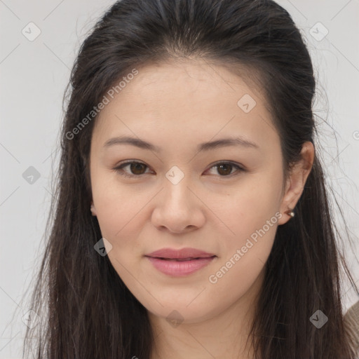 Joyful asian young-adult female with long  brown hair and brown eyes