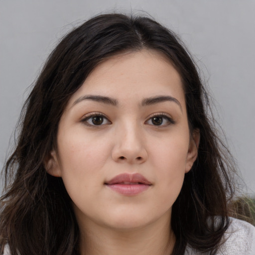 Neutral white young-adult female with long  brown hair and brown eyes