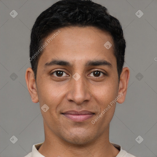 Joyful latino young-adult male with short  brown hair and brown eyes