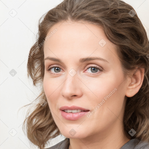 Joyful white young-adult female with medium  brown hair and blue eyes