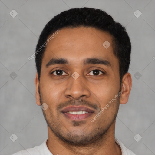 Joyful latino young-adult male with short  black hair and brown eyes