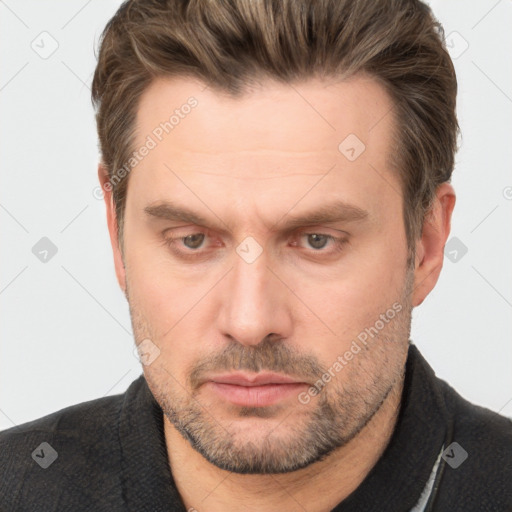 Neutral white adult male with short  brown hair and brown eyes