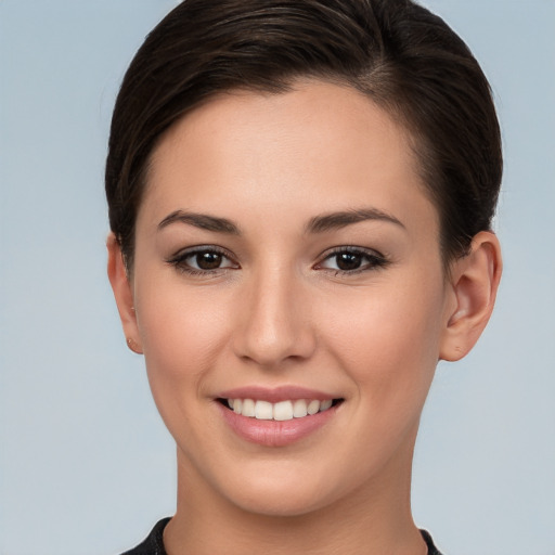 Joyful white young-adult female with short  brown hair and brown eyes