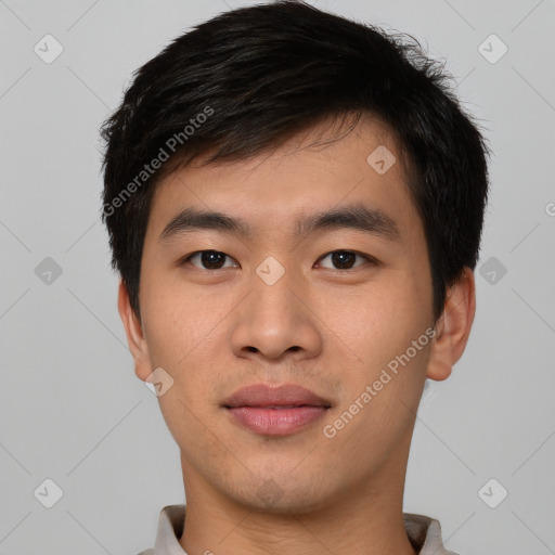 Joyful asian young-adult male with short  black hair and brown eyes