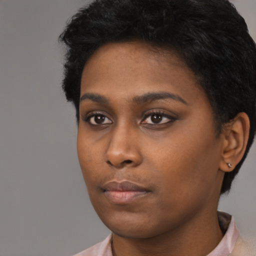 Neutral black young-adult female with short  black hair and brown eyes