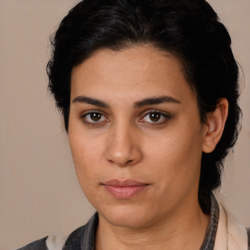 Neutral latino young-adult female with medium  brown hair and brown eyes