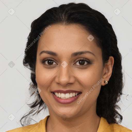 Joyful latino young-adult female with long  brown hair and brown eyes