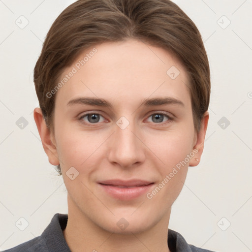 Joyful white young-adult female with short  brown hair and grey eyes