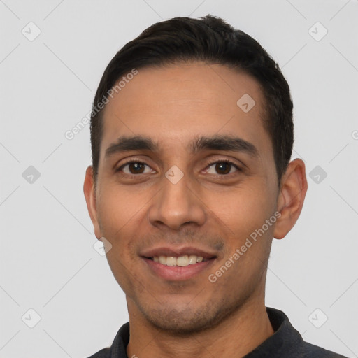 Joyful white young-adult male with short  black hair and brown eyes