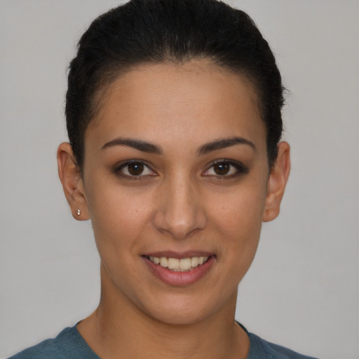 Joyful white young-adult female with short  brown hair and brown eyes