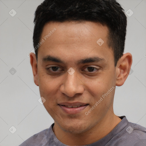 Joyful white young-adult male with short  black hair and brown eyes