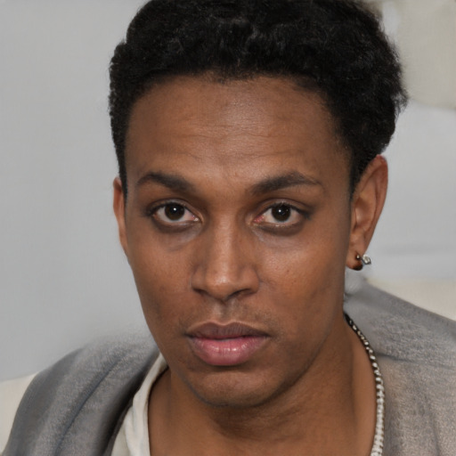 Neutral black young-adult male with short  black hair and brown eyes