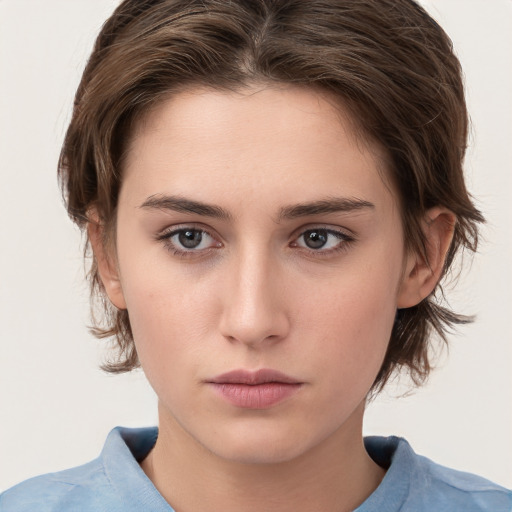 Neutral white young-adult female with medium  brown hair and brown eyes