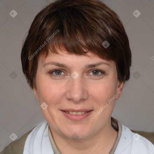 Joyful white young-adult female with short  brown hair and grey eyes