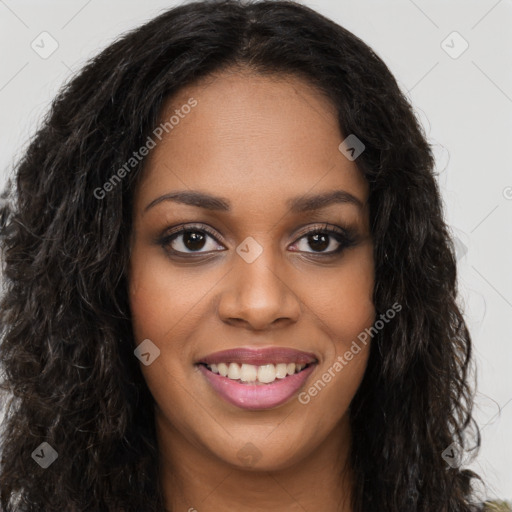 Joyful black young-adult female with long  brown hair and brown eyes