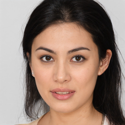 Joyful white young-adult female with long  brown hair and brown eyes