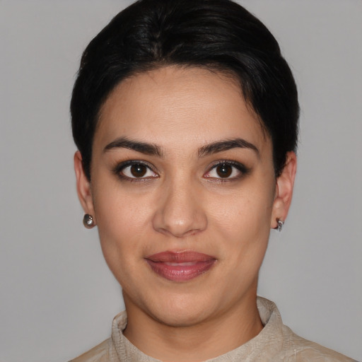 Joyful white young-adult female with short  black hair and brown eyes