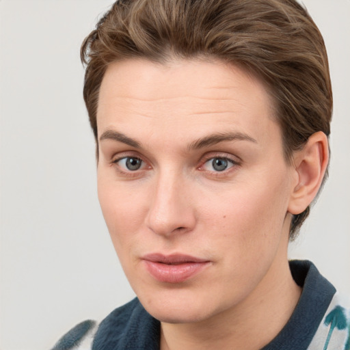 Neutral white young-adult female with medium  brown hair and grey eyes