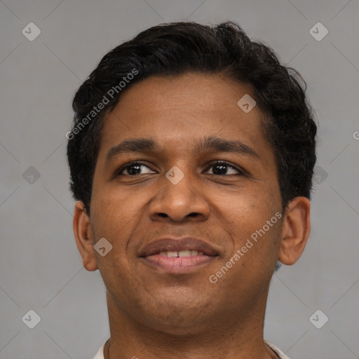 Joyful latino young-adult male with short  brown hair and brown eyes