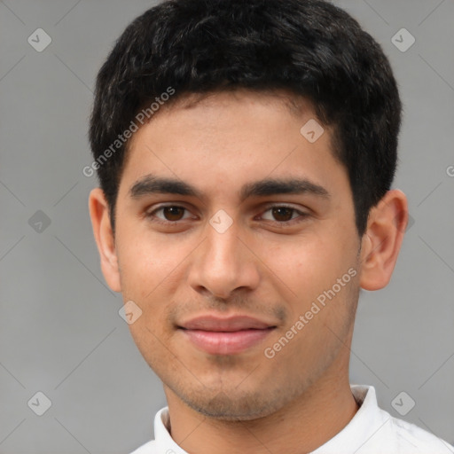 Joyful latino young-adult male with short  brown hair and brown eyes