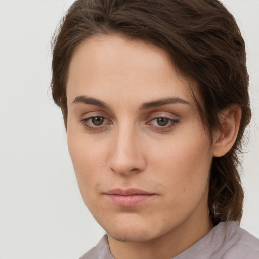 Neutral white young-adult female with short  brown hair and brown eyes