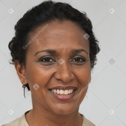 Joyful black adult female with short  brown hair and brown eyes