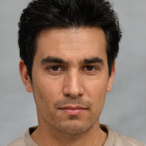 Neutral white young-adult male with short  black hair and brown eyes