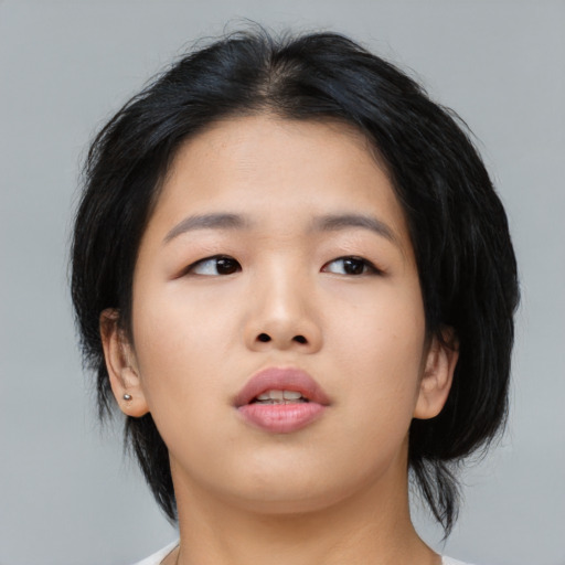 Neutral asian young-adult female with medium  black hair and brown eyes