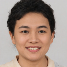 Joyful asian young-adult female with short  brown hair and brown eyes