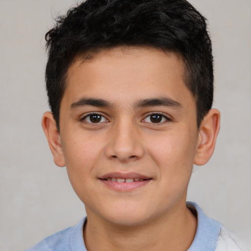 Joyful white child male with short  brown hair and brown eyes