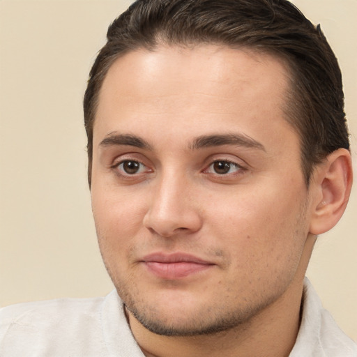 Joyful white young-adult male with short  brown hair and brown eyes