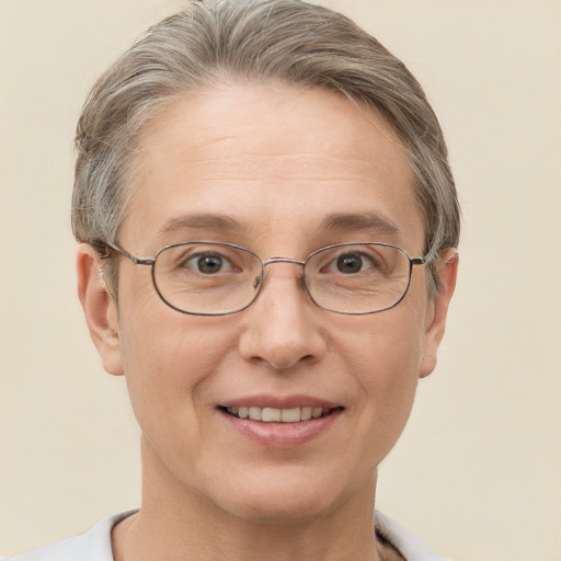 Joyful white adult female with short  brown hair and brown eyes