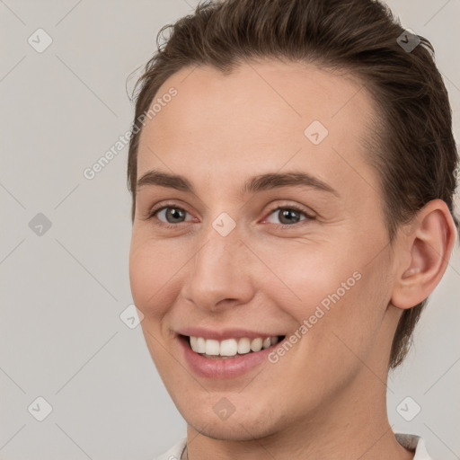 Joyful white young-adult female with short  brown hair and brown eyes