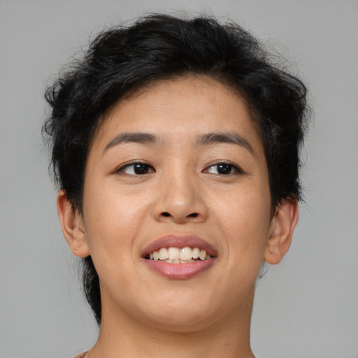 Joyful asian young-adult female with short  brown hair and brown eyes