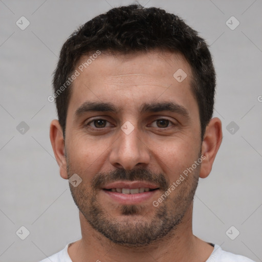 Joyful white young-adult male with short  brown hair and brown eyes