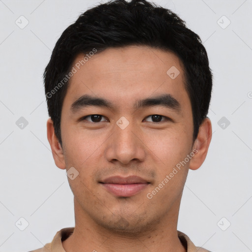 Joyful asian young-adult male with short  black hair and brown eyes