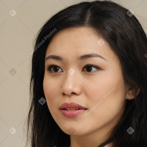 Joyful latino young-adult female with long  black hair and brown eyes