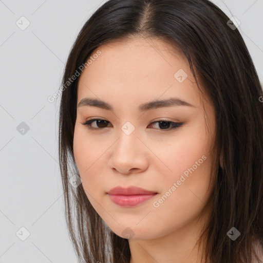 Joyful asian young-adult female with long  brown hair and brown eyes